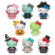 the hello kitty figurines are all dressed up in different colors and sizes, including one wearing a top hat