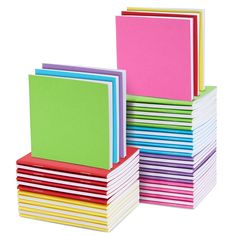 a stack of assorted colored papers on a white background