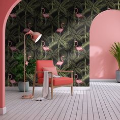 a living room with pink walls and flamingos on the wall