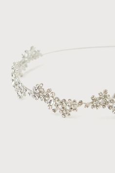 Celebrate big moments as they deserve in a gorgeous piece like the Lulus Sparkling Occasion Silver Rhinestone Headband! Shiny silver-toned metal shapes this darling headband that has a slender wire band. Clusters of glittering rhinestones throughout add a subtle floral effect, for a perfect finishing touch to your most elegant looks. Measures 15. 5" From End To End And 1. 25" Wide. Rhodium Plated Alloy 98%, Rhinestone 2%. Imported. Lulus | Sparkling Occasion Silver Rhinestone Headband. Prom Headband, Silver Rhinestone Headband, Diamond Headband, Rhinestone Headband, Silver Rhinestone, Shiny Silver, Rhodium Plated, Silver Tone, Sparkle