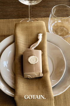 A Christmas table setting featuring mustard woven linen napkins, dried floral centerpieces with ribbon, and rustic decor on a wooden table. Room Curtains, Holiday Table