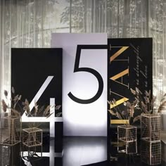 the number five is displayed in front of an artistic display