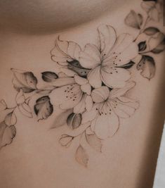 a woman's stomach with flowers on it