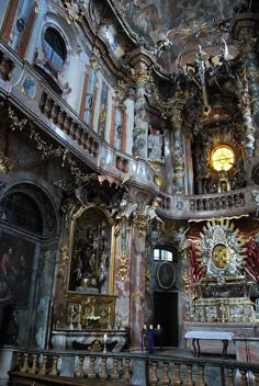 the interior of an ornately decorated church