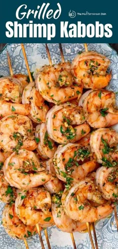 grilled shrimp kabobs on skewers with parsley garnish