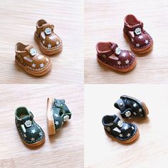 four different types of baby shoes sitting on top of a wooden table