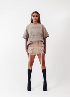 Get ready to amp up your streetwear game with our freshest creation - introducing the ACS Mini Cargo Skirt! We've poured our techwear and streetwear passion into this beauty, and we can't wait for you to experience it firsthand. *Intricate Design, Striking Look: Dive into the dynamic front design, featuring cargo pockets and hanging straps. This combination crafts a unique silhouette that effortlessly catches attention, making each step a statement. *Beige Colorway: Elevate your wardrobe with the versatile light beige hue. It effortlessly complements your existing collection, offering a canvas for endless creative pairings. *Perfect Mini Length: The ACS Mini Cargo Skirt strikes the ideal balance between mini and comfort  *Customized Comfort, Adjustable Waistband: Experience the luxury of a Y2k Mini Skort For Streetwear, Y2k Style Mini Skort For Streetwear, Y2k Fitted Skirt For Streetwear, Fitted Y2k Skirt For Streetwear, Y2k Denim Mini Skirt For Streetwear, Y2k Style Mini Denim Skirt For Streetwear, Fitted Cargo Skirt For Summer Streetwear, Y2k Mini Skirt For Streetwear, Trendy Cotton Denim Skirt For Streetwear