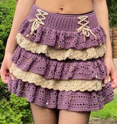 a close up of a person wearing a skirt with crochet on the bottom