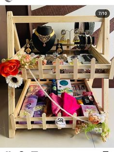 a display case with jewelry and necklaces on it