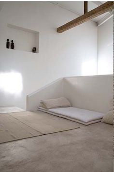 an empty room with white walls and carpeted flooring is pictured in this image