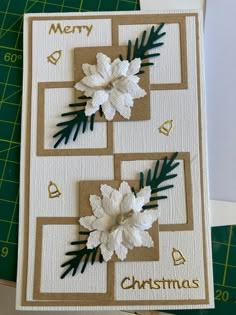 a handmade christmas card with white flowers