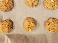 six cookies sitting on top of a baking sheet