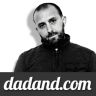 a black and white photo of a man with a beard in front of the words dadadd com