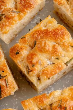 several slices of bread with herbs on top