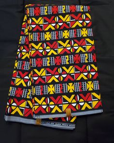 DESCRIPTION Black, Yellow and Red Multicolor African Ankara Fabric. This is high quality African print is 100% cotton and it's 45 inches wide. It is used for making African Clothing, African quilts, & For Home decoration. FYI: Print is Double sided. The listing is for 2yards, 3yards, 6yards and Headwrap Each piece of fabric measures: 70-72in by 45in for 2yards 105-108in by 45in for 3yards 210-216in by 45in for 6yards 70in by 22in for Head wrap If you purchase more than one yard, you will receive one continuous piece. *If you require more than what I have listed, feel free to send me email. CARE INSTRUCTIONS:•DO NOT BLEACH•Hand wash with cold water and mild soap or Dry clean•Press with warm iron on the wrong side only. Color may be different due to your monitor African Quilts, Clean And Press, Head Wrap Headband, Ankara Print, African Ankara, Fabric Headbands, African Print Fabric, Ankara Fabric, Red And Yellow