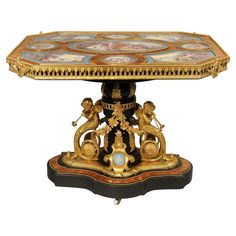 an ornately decorated table with figures on it