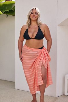 Coral Sarong Plus Size Get ready to turn heads with our fun and fresh sarong in Coral! Designed to complement your favourite swimsuit prints, this beautiful coral shade is perfect for adding a tropical feel to your summer style. Whether you’re pairing it with our floral swimsuit collections or using it to accentuate solid colours, this sarong skirt brings effortless style to any beach day look. Made from super soft 100% cotton, this versatile piece isn’t just stylish—it’s functional too! Wrap it Coral Beachwear Swimwear, Summer Cotton Sarong For Beach, Beach Sarong For Cover-up, Cotton Sarong For Beach Vacation, Cotton Sarong For Beach Season Vacation, Beach Wrap Sarong, Beachy Cotton Sarong For Beach, Beachy Cotton Sarong For Vacation, Cotton Sarong For Spring Beach Cover-up