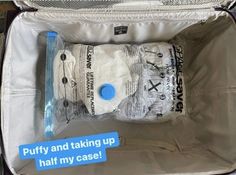 an open suitcase with some items in it that say putty and taking up half my case