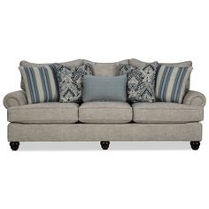 a gray couch with blue and white pillows