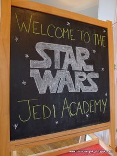 a welcome sign to the star wars jedi academy is posted on a chalkboard