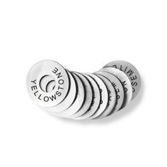 six white buttons with words on them