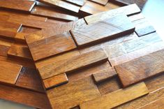 several pieces of wood laid out on top of each other in the shape of squares and rectangles