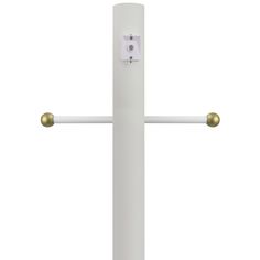 a white cross with two gold handles on the front and back of it, against a white background