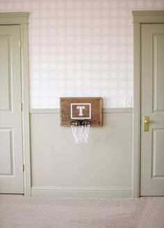 a basketball hoop mounted to the wall in a room