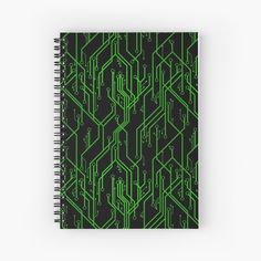 a spiral notebook with green and black lines in the shape of an electronic circuit board