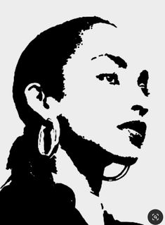 a black and white photo of a woman's face with earrings on her ear