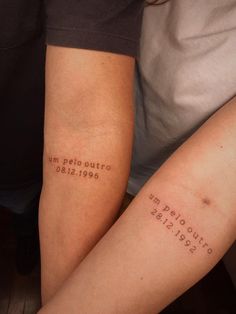 two people sitting next to each other with tattoos on their legs that say, i am peloutro