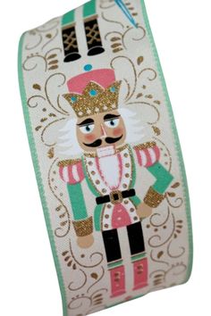 a white and green ribbon with an image of a nutcracker wearing a crown