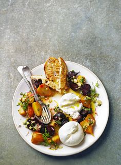 a white plate topped with food and a fork