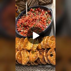 a table topped with lots of food next to a bowl of salsa and bread slices