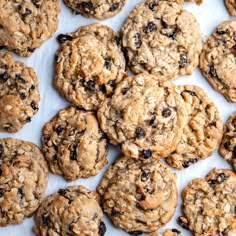 a bunch of cookies that are sitting on a sheet of paper with some oats in the middle