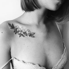 a woman with a tattoo on her chest