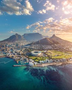 an aerial view of cape town with mountains in the background