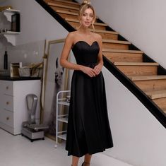 This elegant strapless dress is the epitome of sophistication, available in classic black and soft sky blue. Perfect for formal events or special occasions, the structured corset ensures a flattering and sculpted silhouette, while the midi-length skirt adds a timeless elegance to your look. Sizes Available: XS, S, M, L Total Length: 105 cm, with a skirt length of 80 cm Corset: Dense, glued corset for impeccable shape and support Colors: Choose from two stunning options - black or sky blue Occasi Strapless Midi Dress With Fitted Bodice For Night Out, Strapless Formal Dress With Corset Back, Evening Midi Dress With Sweetheart Neckline And Fitted Bodice, Strapless Evening Dress With Corset Back For Night Out, Strapless Evening Dress With Fitted Bodice For Night Out, Black Corset Dress With Ruched Bodice For Prom, Strapless Solid Color Formal Dress, Elegant Fitted Bandeau Strapless Dress, Dressy Strapless Evening Dress For Prom Season