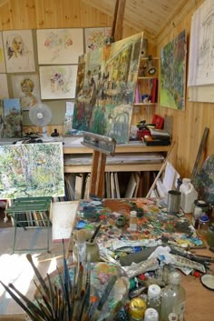 an artist's studio filled with lots of art supplies