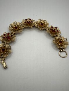 Vintage filagree gold tone metal bracelet flower style sections with deep tea crystal stones Bracelet Flower, Flower Style, Metal Bracelet, Crystal Stones, Red Stone, Metal Bracelets, Flower Fashion, Gold Tone Metal, Stones And Crystals