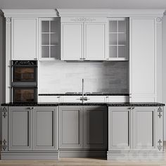 a kitchen with white cabinets and black counter tops in the middle of an open floor plan