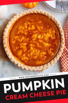 a pumpkin cream cheese pie sitting on top of a table