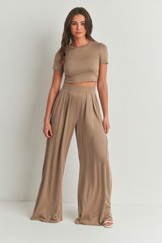 The Cara Pants Set offers a versatile and stylish option for any occasion. With its crop top and palazzo pants set, you can easily dress it up or down. The mock neck and short sleeves provide a chic touch, while the mid-rise and wide leg pants offer comfort and a flattering silhouette. Made with a very stretchy and extra soft fabric, this set is perfect for all-day wear. Top And Palazzo Pants, Pleated Palazzo Pants, Flattering Outfits, Palazzo Pant, Wide Leg Palazzo Pants, Crop Top Sweater, Dresses By Length, Neck Crop Top, Knit Crop Top