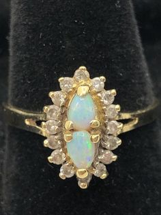 Beautiful 14K Yellow Gold Natural Opal 0.28CTW with Round Diamond Accents 0.30CTW 4.0gr. Size 8.5 Natural Opal, Round Diamond, Round Diamonds, Jewelry Watches, Jewelry Rings, Opal, Fine Jewelry, Yellow Gold, Yellow