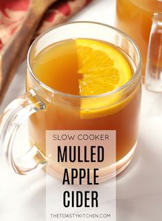 a glass mug filled with mulled apple cider