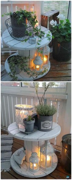 some plants and candles are sitting on top of a table in front of a window