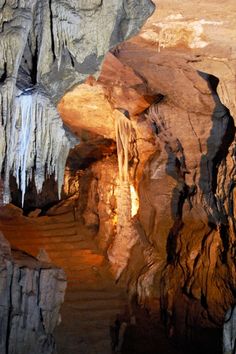 the inside of a cave with water flowing from it