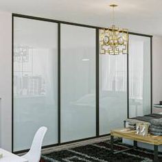 a living room with sliding glass doors and furniture