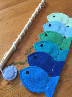 several pieces of felt sitting on top of a wooden table