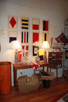 a living room filled with furniture and pictures on the wall